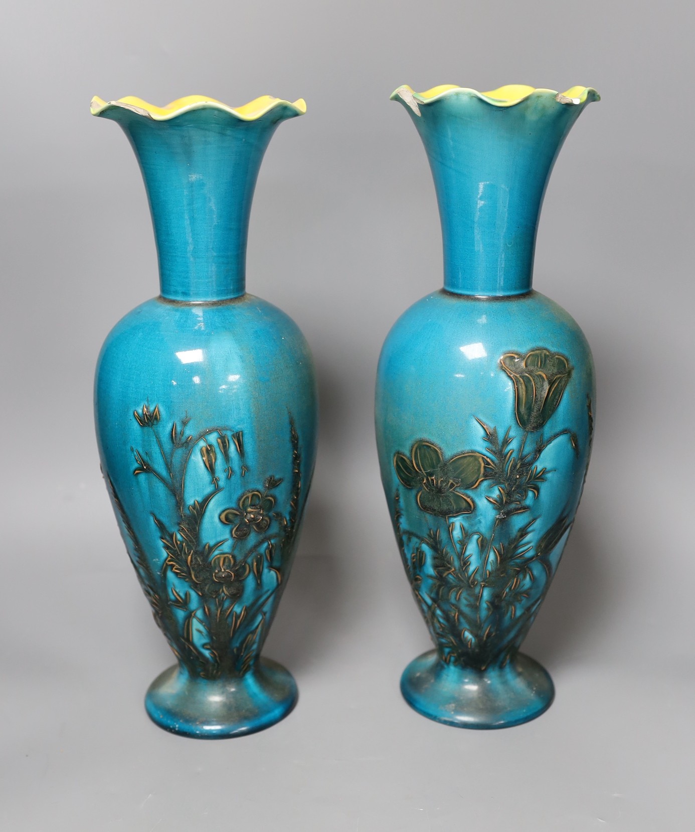 A pair of Linthorpe turquoise glazed pottery vases, impressed model no 2219, incised mark AS. 36cm high